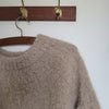 

Suri – Sweater
12